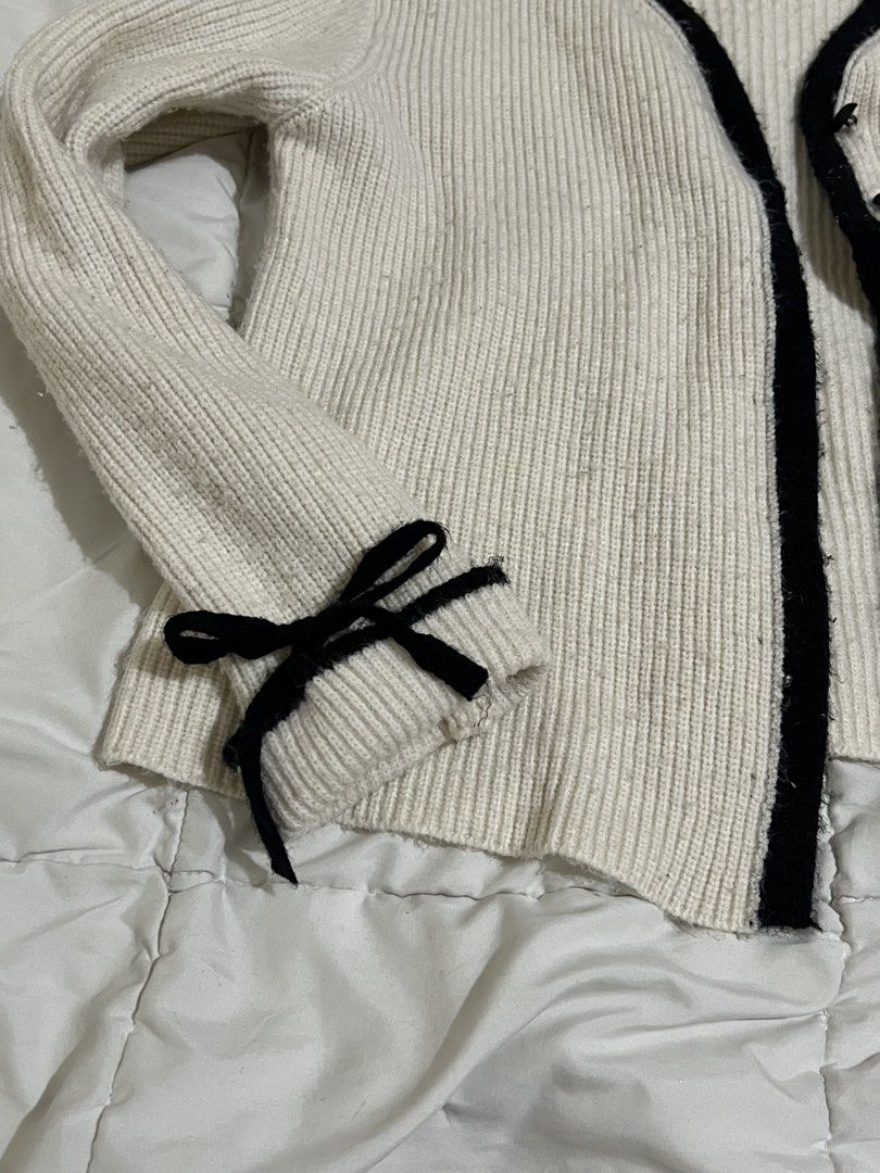 cream cardigan with black trim (Category: Coats, Jackets and Outerwear) located in Manila. Submitted by lauravln (Listing ID 1427596822, Image 3). Description: has signs of usage.
