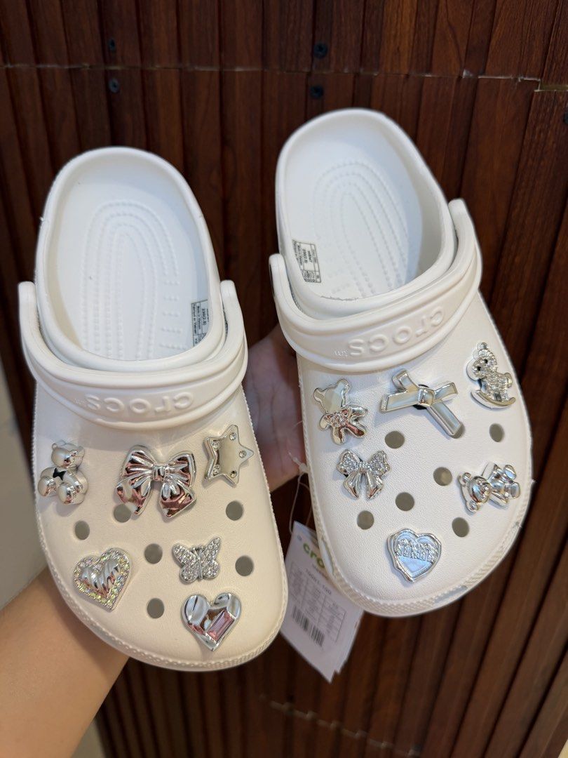 Crocs Classic Clog White with Jibbitz Charms (Category: Slippers and slides) located in Bulacan. Submitted by stepnstyle8888 (Listing ID 1427512933, Image 1). Description: Size 6-9 .