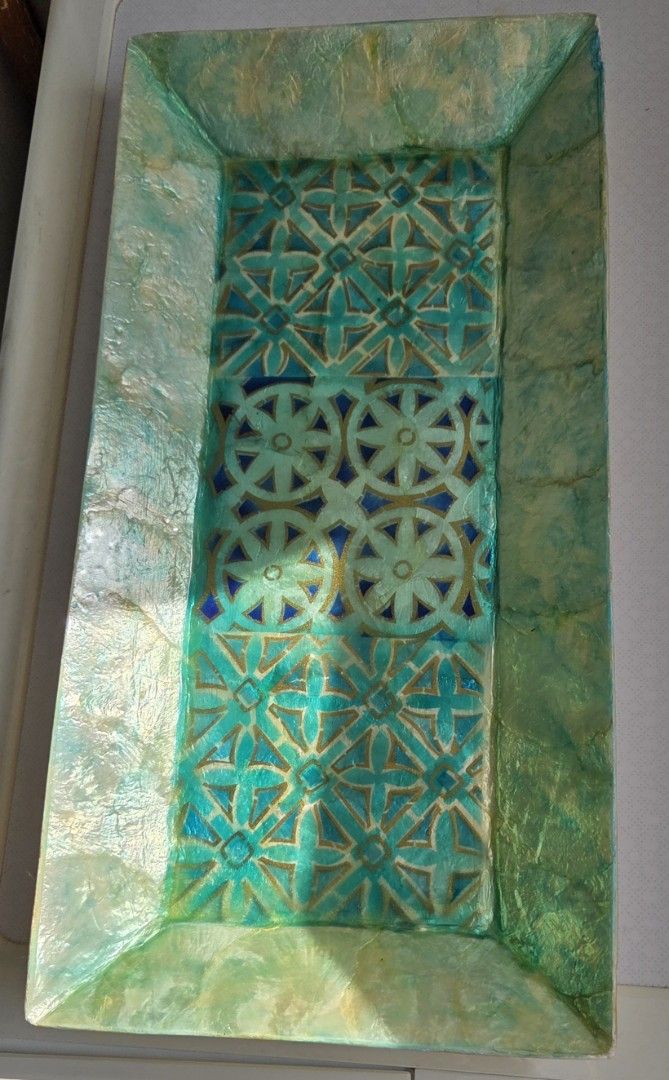 Decorative Rectangular Seashell Tray (Category: Other Home Decor) located in Singapore. Submitted by happiness09 (Listing ID 1427532499, Image 3). Description: Handmade turquoise seashell tray. Beautiful and elegant with unique designs. Natural vibrant colour with a mix of hand-painted gold designs. Ideal for display on its own or displaying decorative items. Length: est 40cm Breadth: est 20cm.