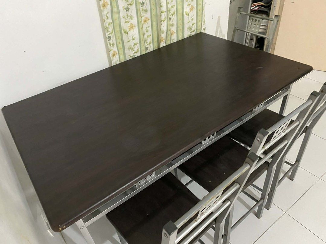 URGENTLY DECLUTTERING: Dining Table with 4 Chairs (Category: Tables & Sets) located in Marikina City. Submitted by declutteringmommm (Listing ID 1427583632, Image 2). Description: As is where is. Sturdy. Just that the frames are a lil bit old and some bits of rust. Does not affect the function. Can be re-painted and it will all look new. From Santa Rosa, Laguna. .