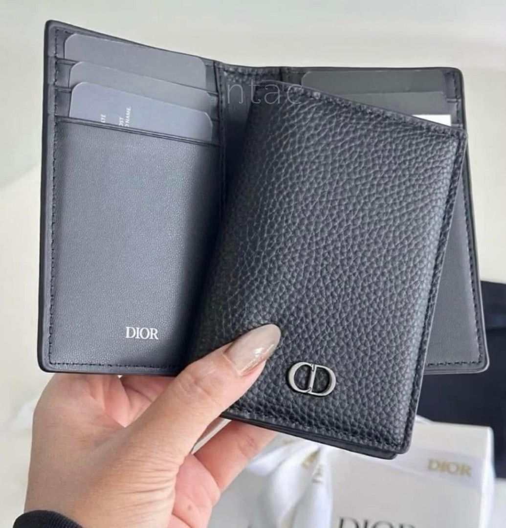 Dior Black Calf Leather Card Holder (Category: Luxury Bags & Wallets) located in Manila. Submitted by nicethingsandstuff (Listing ID 1427603462, Image 2). Description: Dior card holder is crafted from black leather. It features the iconic CD logo on the front. The interior includes multiple card slots. It comes with its original box, dust bag..