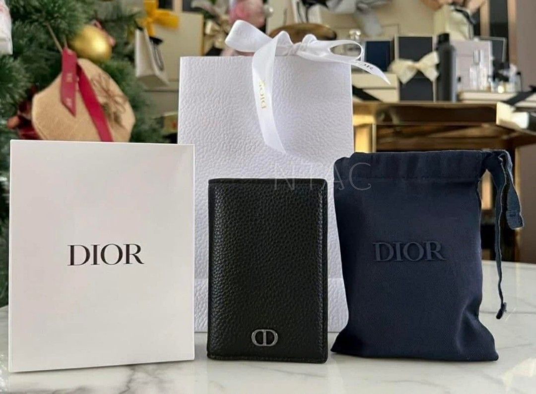 Dior Black Calf Leather Card Holder (Category: Luxury Bags & Wallets) located in Manila. Submitted by nicethingsandstuff (Listing ID 1427603462, Image 1). Description: Dior card holder is crafted from black leather. It features the iconic CD logo on the front. The interior includes multiple card slots. It comes with its original box, dust bag..