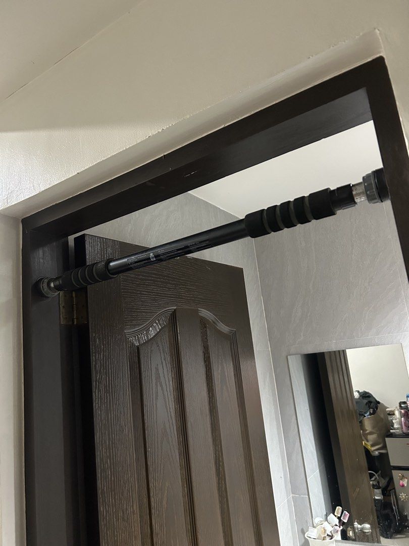 Doorway Pull-up Bar (Category: Weights & Dumbbells) located in Mandaluyong City. Submitted by ncooooooo (Listing ID 1427565292, Image 1). Description: Pull up bar for door-way - Supports 100kg (accdg. to label) - With screw tightening mechanism for a secure fit. Item was barely used and accumulated minimal rust over time. Handles are still in great condition. RFS: The door frame in my apartment is kinda soft for this kind of bar. Still negotiable