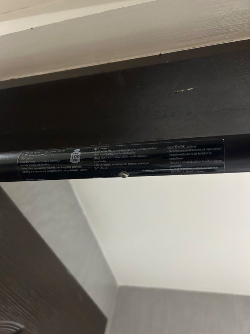 Doorway Pull-up Bar (Category: Weights & Dumbbells) located in Mandaluyong City. Submitted by ncooooooo (Listing ID 1427565292, Image 2). Description: Pull up bar for door-way - Supports 100kg (accdg. to label) - With screw tightening mechanism for a secure fit. Item was barely used and accumulated minimal rust over time. Handles are still in great condition. RFS: The door frame in my apartment is kinda soft for this kind of bar. Still negotiable