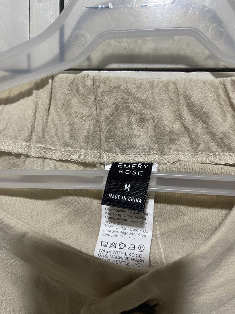 Emery Rose Beige Shorts - Size M (Category: Shorts) located in Quezon City. Submitted by lespyjamas (Listing ID 1427527416, Image 2). Description: - Features a button closure and a comfortable design. - Made in China. - The shorts appear to be made of a lightweight fabric, suitable for warm weather. - The shorts have a simple, classic style, making them versatile for various outfits..