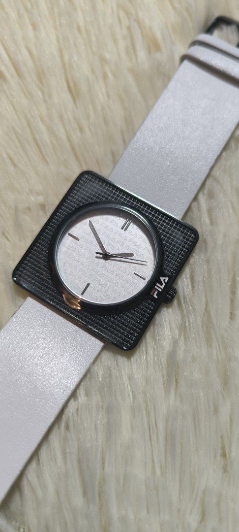 FILA White Square Face Watch - Quartz Miyota Movement (Category: Women's Watches) located in Manila. Submitted by Ms.Joycee (Listing ID 1427536321, Image 3). Description: • Model: 38-022 Series • Unisex Watch • Genuine Leather (White belt) • Stainless Steel Case • Water Resistant 3 ATM Complete inclusion: -price tag -original box -International warranty -owner's manual Unused item Bought in Japan Plastic are still intact.