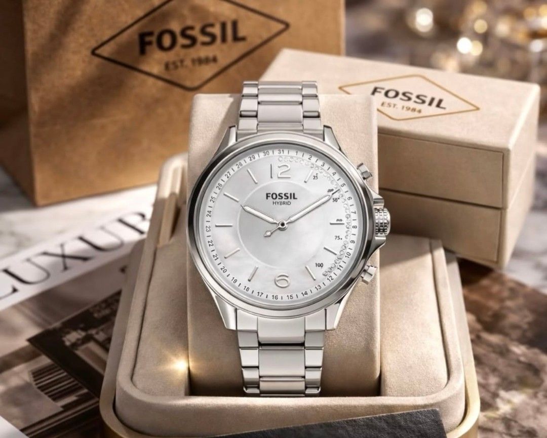 Fossil Hybrid Smartwatch (Category: Men's Watches) located in Manila. Submitted by maricelbal37348 (Listing ID 1427575524, Image 2). Description: Stylish Fossil Hybrid smartwatch. Features a round face with analog hands and a subdial. The watch has a metal band and a classic design. Comes with its original box. Available in multiple colors: gold, silver, and rose gold..