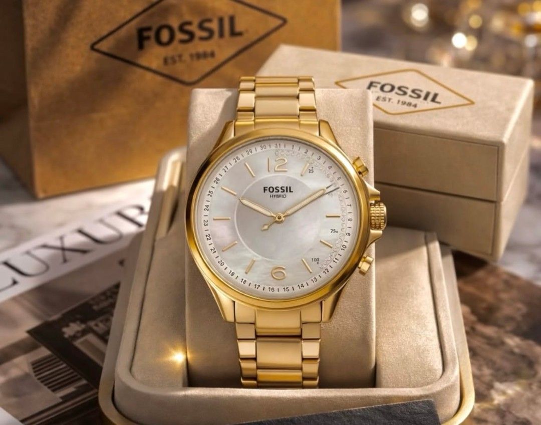 Fossil Hybrid Smartwatch (Category: Men's Watches) located in Manila. Submitted by maricelbal37348 (Listing ID 1427575524, Image 1). Description: Stylish Fossil Hybrid smartwatch. Features a round face with analog hands and a subdial. The watch has a metal band and a classic design. Comes with its original box. Available in multiple colors: gold, silver, and rose gold..