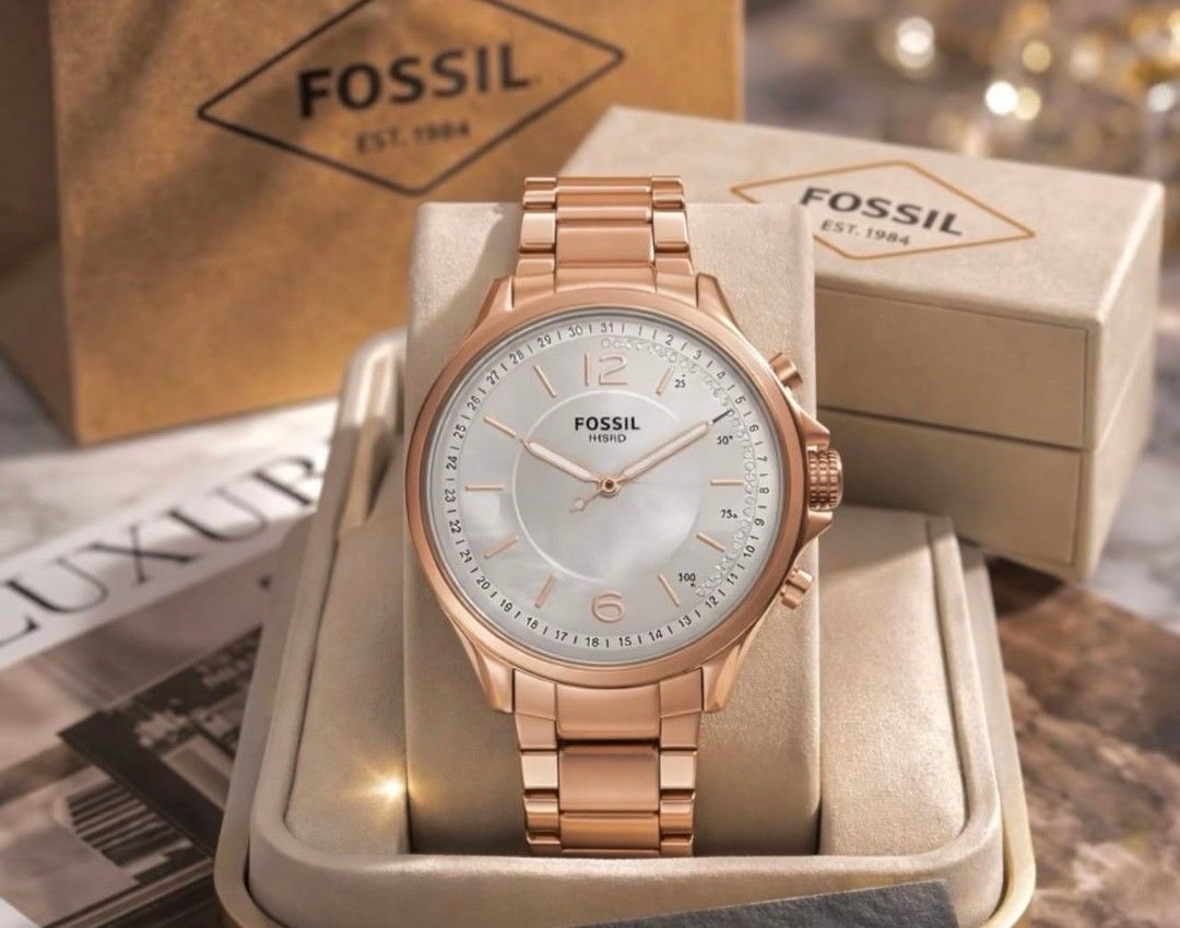 Fossil Hybrid Smartwatch (Category: Men's Watches) located in Manila. Submitted by maricelbal37348 (Listing ID 1427575524, Image 3). Description: Stylish Fossil Hybrid smartwatch. Features a round face with analog hands and a subdial. The watch has a metal band and a classic design. Comes with its original box. Available in multiple colors: gold, silver, and rose gold..