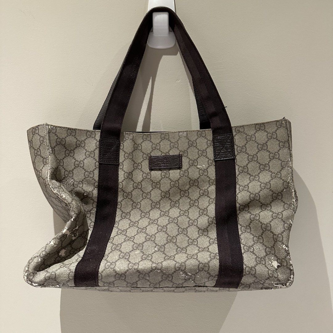 Gucci GG Canvas Tote Bag (Category: Luxury Bags & Wallets) located in Pasay City. Submitted by do.es (Listing ID 1427626070, Image 1). Description: My mother-in-law gave it to me & asked if I wanted to repair and use it. Never got the chance to (was thinking to put patch designs) ans i might not have the time to ever do it. It’s authentic! Negotiable price given the outer damage. Other than the cracks, material of the handle is still good and the