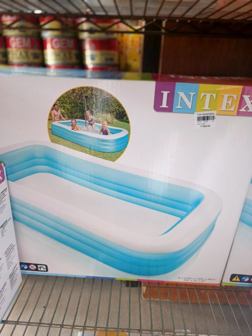Intex Rectangular Pool (Category: Water Sports) located in San Pedro. Submitted by cgi.saversplustrading (Listing ID 1427490156, Image 1). Description: Intex rectangular pool is perfect for family fun. It features a blue and white design and is ideal for kids. The pool dimensions are 3.05m x 1.83m x 56cm (120" x 72" x 22"). It's a great way to cool off and enjoy the summer. The box shows a picture of people enjoying the pool..