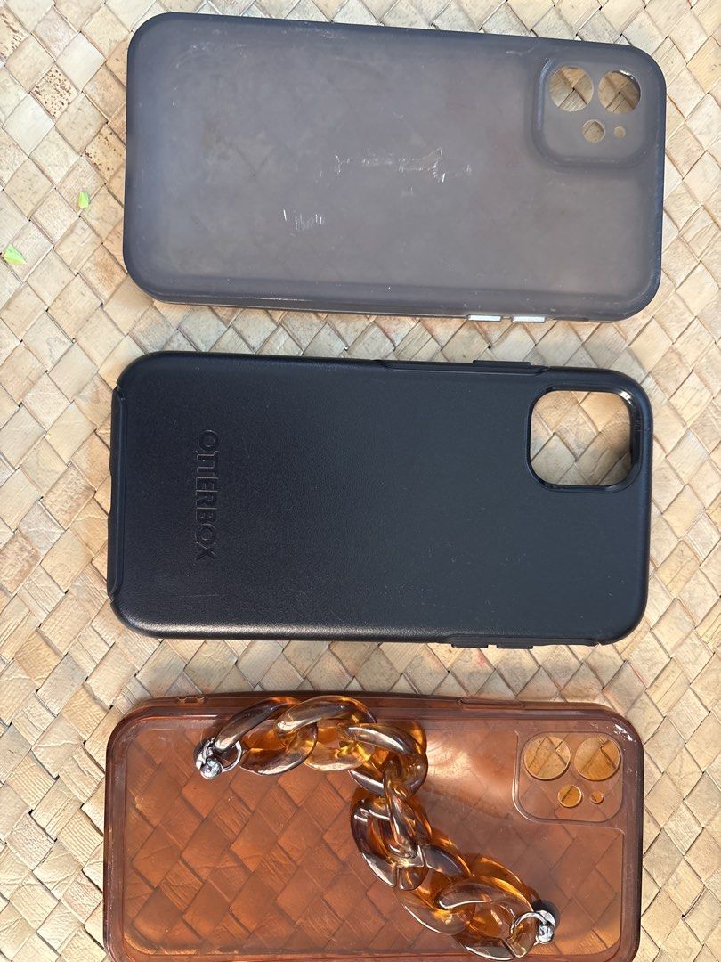 iPhone 11 case (Category: Cases & Sleeves) located in Rizal. Submitted by juliakejdn (Listing ID 1427564792, Image 3). Description: - iPhone 11 case collection - Includes: - Black Otterbox case - Smoky case - Brown case with chain detail.