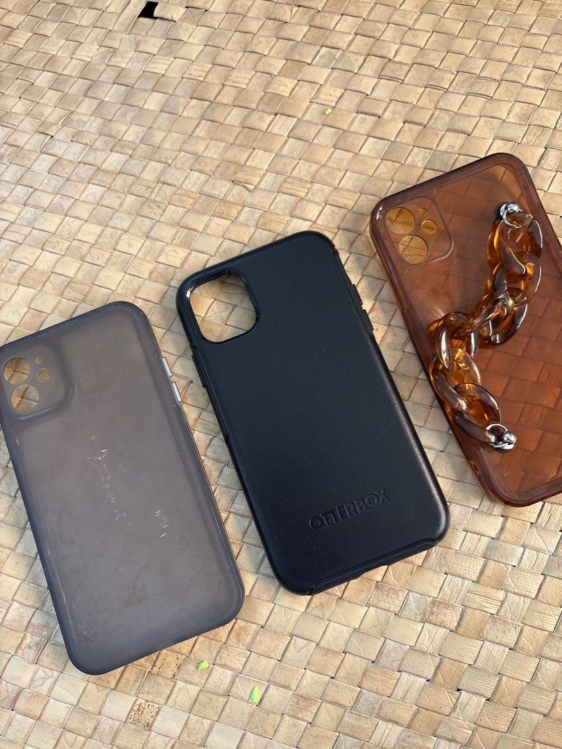 iPhone 11 case (Category: Cases & Sleeves) located in Rizal. Submitted by juliakejdn (Listing ID 1427564792, Image 2). Description: - iPhone 11 case collection - Includes: - Black Otterbox case - Smoky case - Brown case with chain detail.