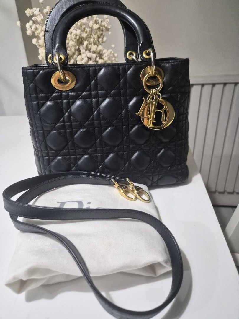 Lady Dior Medium (Category: Luxury Bags & Wallets) located in Manila. Submitted by fasyon (Listing ID 1261921151, Image 1). Description: authentic color black gold hardware with dustbag, insert organizer, and entrupy certificate no damage or major flaws hardware on the straps have faded but overall still looks good there are signs of wear and tear.