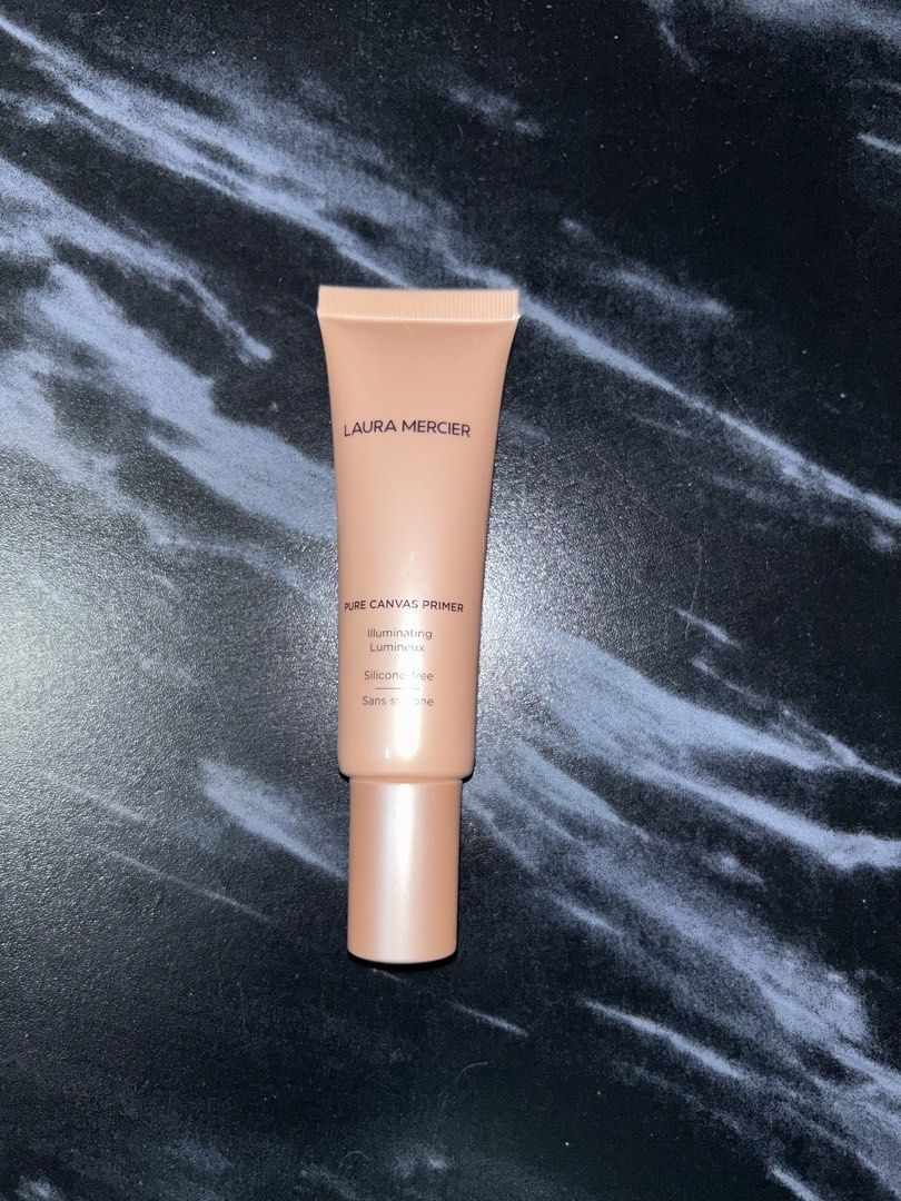 Laura Mercier Pure Canvas Primer Illuminating (Category: Makeup) located in Valenzuela. Submitted by jamcolecciones (Listing ID 1427606841, Image 1). Description: Laura Mercier Pure Canvas Primer Illuminating. This primer is silicone-free. It is 50 ml / 1.7 fl. oz. The product is in a peach-colored tube. The back of the tube has product information. Made in Italy..