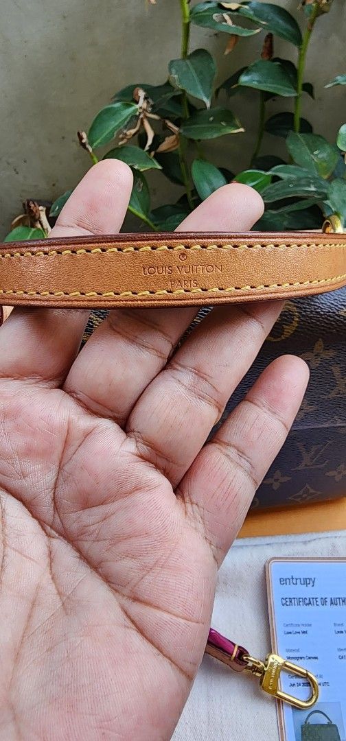 Louis Vuitton clunny (Category: Luxury Bags & Wallets) located in San Ildefonso. Submitted by chelsea_manalang42 (Listing ID 1427524396, Image 3). Description: Authentic Louis Vuitton Dauphine Mini handbag. Features the iconic Monogram canvas with a pink interior. Includes a detachable pink shoulder strap and a top handle. Comes with an Entrupy certificate of authenticity. The bag has a gold-tone hardware and a flap closure. Includes the original