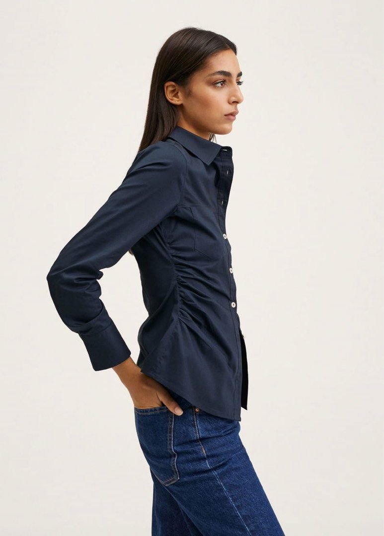 Mango Navy Gathered Shirt (Category: Shirts) located in Manila. Submitted by cchloeee (Listing ID 1427518154, Image 2). Description: Gathered side top ✨ Brand new w/ tag Flattering fit that snatches the waist .