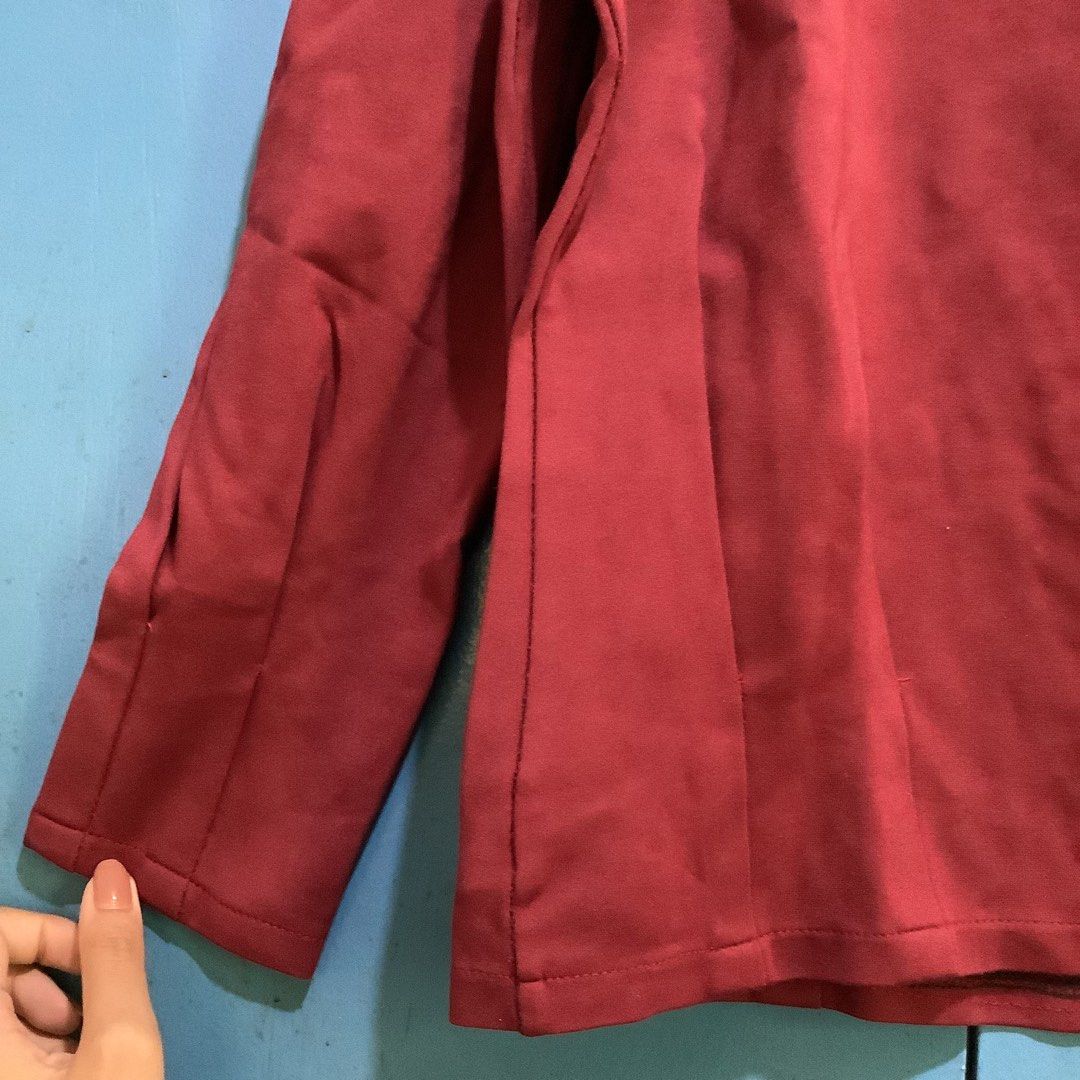 Maroon Ruffle Neck Blouse (Category: Blouses) located in Cabanatuan. Submitted by chieezyx (Listing ID 1427557615, Image 3). Description: asymmetrical sleeves.
