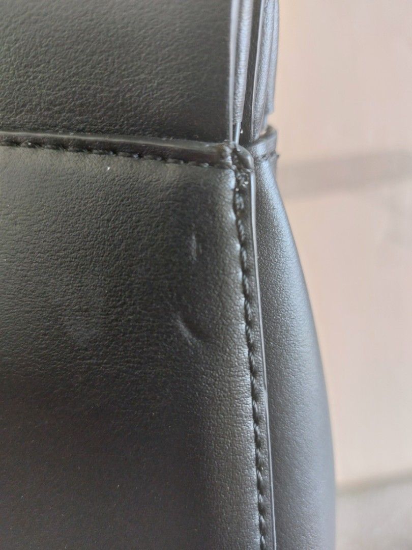 Michael Kors Black Handbag with Lock (Category: Luxury Bags & Wallets) located in Malaybalay. Submitted by mags_sofia (Listing ID 1427591712, Image 3). Description: Dimensions: L: 17.5", W: 4.5", H: 10.5" Material: - leatherette exterior and polyester interior - gold brass hardware - includes dry bag & strap Compartment: - first main compartment has one zipped pocket - second main compartment has one slot Signs of Wear: - leather edges are worn o