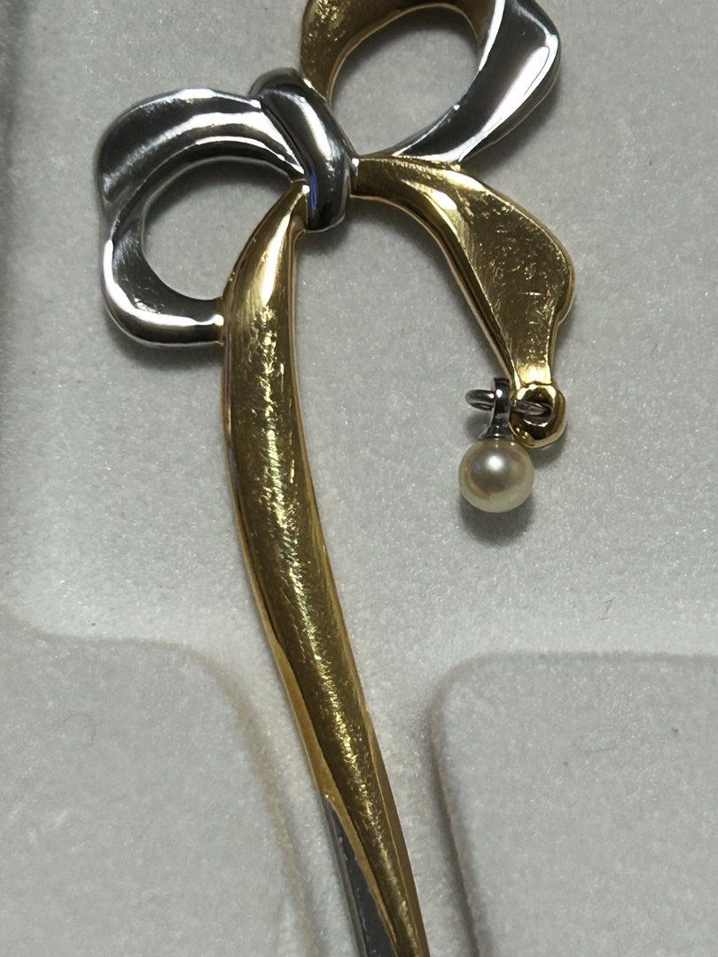 Bo26Mikimoto Spoon Set with Pearl (Category: Dinnerware & Cutlery) located in Angeles City. Submitted by zyeplustradings (Listing ID 1427605264, Image 3). Description: Elegant Mikimoto spoon set. Features a bow design with a small pearl pendant. The spoons have a gold and silver color scheme. The set comes in its original box. The spoons are marked with "MIKIMOTO 18-8"..