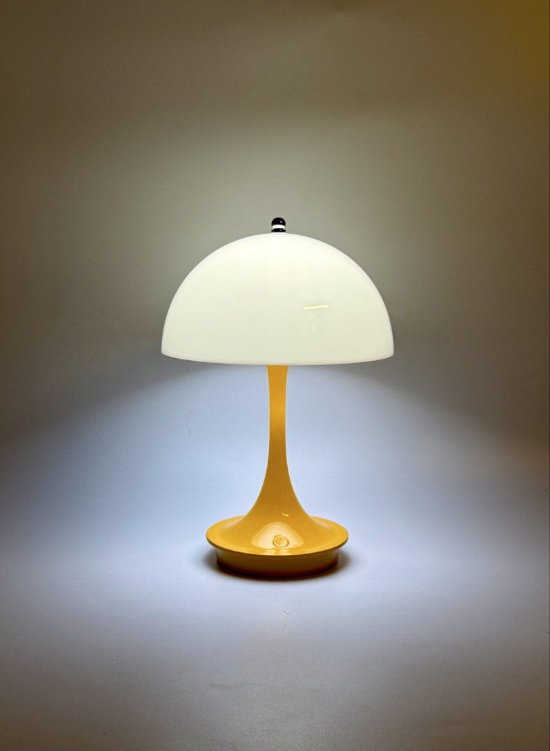 Mustard Yellow Panthella Danish Scandinavian Rechargeable LED Lamp (Repro) (Category: Lighting) located in Manila. Submitted by staylit.ph (Listing ID 1427602435, Image 1). Description: Mustard Yellow Panthella Danish Scandinavian Rechargeable LED Lamp (Repro) • PhP950 (Brand New with Box) • Dimensions: 9”H x 6.5”W • Features: Three Dimmable Light Modes (Warm, Cool, White), Translucent Shade providing soft diffused glow • Colors: White Head, Yell