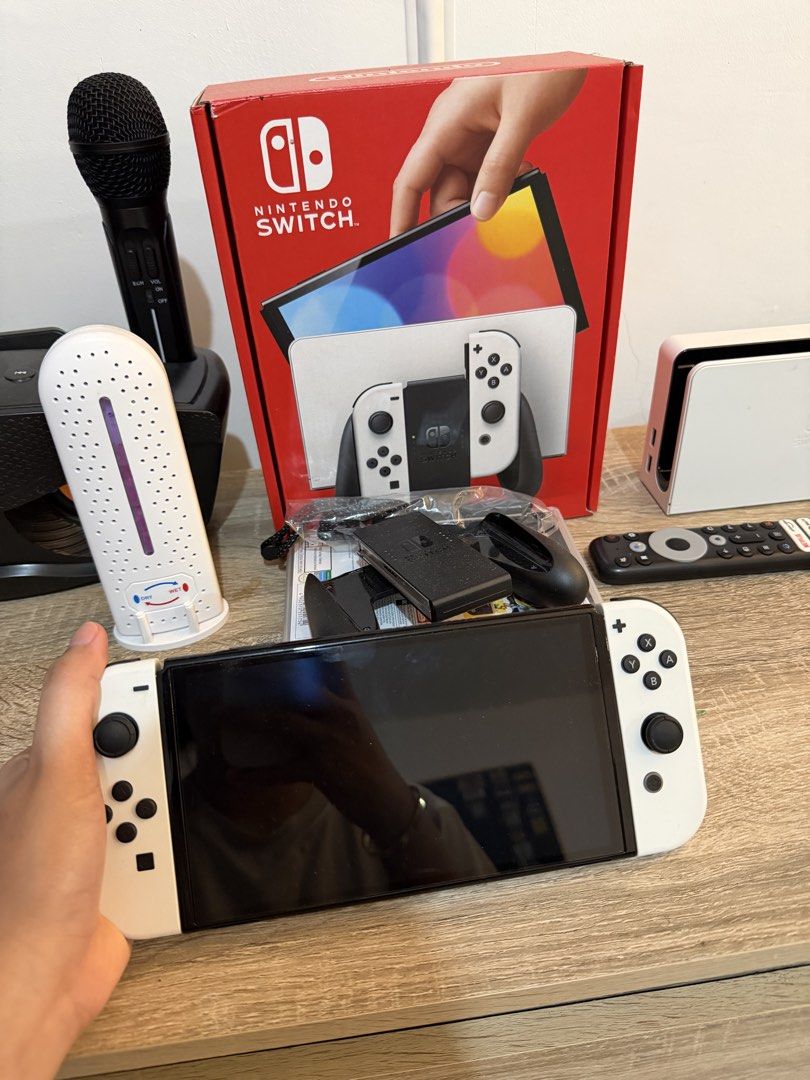 Nintendo Switch OLED White (Category: Nintendo) located in Marikina City. Submitted by lar.luxury (Listing ID 1427629593, Image 1). Description: Used only for a month. Bought in feb. rfs: hindi sanay ang bata, still preferred the ipad Complete package with receipt.