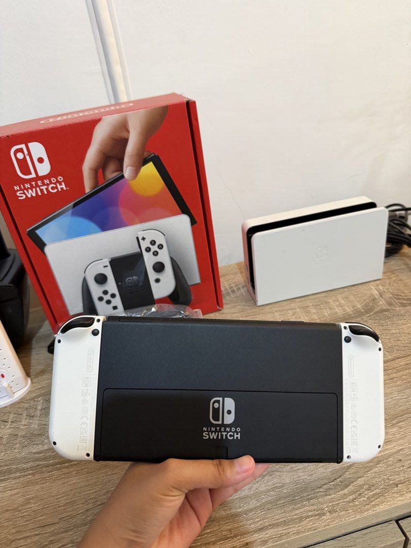 Nintendo Switch OLED White (Category: Nintendo) located in Marikina City. Submitted by lar.luxury (Listing ID 1427629593, Image 3). Description: Used only for a month. Bought in feb. rfs: hindi sanay ang bata, still preferred the ipad Complete package with receipt.