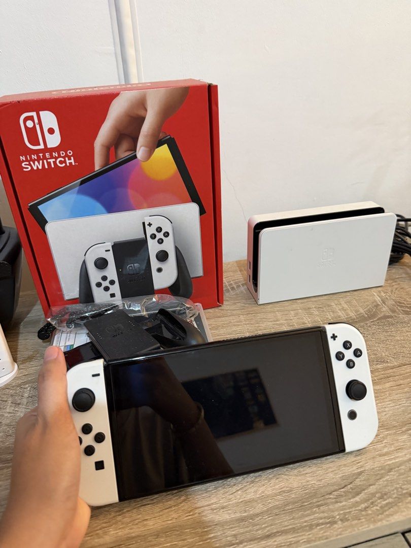 Nintendo Switch OLED White (Category: Nintendo) located in Marikina City. Submitted by lar.luxury (Listing ID 1427629593, Image 2). Description: Used only for a month. Bought in feb. rfs: hindi sanay ang bata, still preferred the ipad Complete package with receipt.