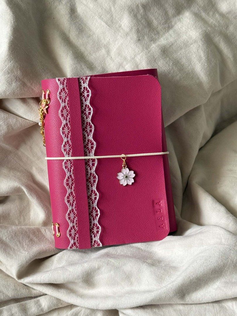 PERSONALIZED LEATHER JOURNAL FOR AS LOW AS 250 PESOS (Category: Stationery & School Supplies) located in Makati City. Submitted by dreamy.pagesph (Listing ID 1427575801, Image 3). Description: INCLUSIONS: • FAUX LEATHER FOLIO WITH 8 HOLES (CAN FIT UP TO 4 NOTEBOOKS) • GROMMETS • STRING CORD • 2 NOTEBOOKS • 1 CHARM • ENGRAVING (< 5 CHARACTERS FREE) BASE PRICE A6: • BIFOLD - 250 PHP • TRIFOLD - 280 PHP A5 • BIFOLD - 350 PHP • TRIFOLD - 380 PHP ADDI