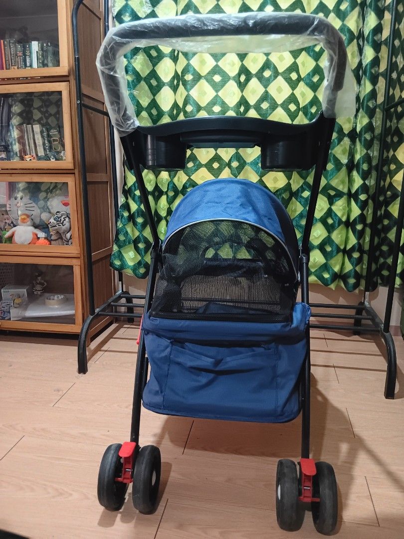 Pet Stroller (Category: Homes & Other Pet Accessories) located in Taguig. Submitted by ncomn (Listing ID 1427512805, Image 2). Description: - Blue pet stroller with mesh enclosure (zipper) - Preloved condition, please manage your expectations.