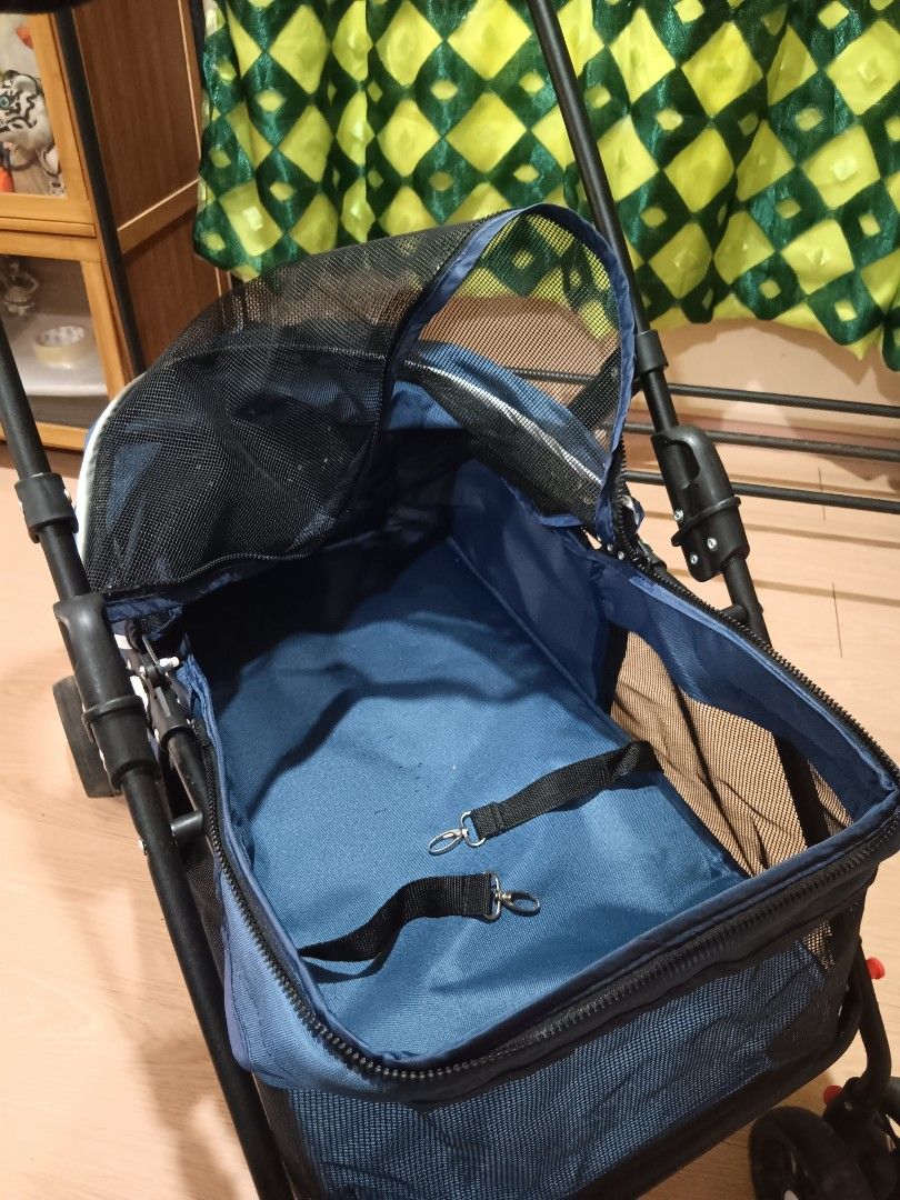 Pet Stroller (Category: Homes & Other Pet Accessories) located in Taguig. Submitted by ncomn (Listing ID 1427512805, Image 3). Description: - Blue pet stroller with mesh enclosure (zipper) - Preloved condition, please manage your expectations.