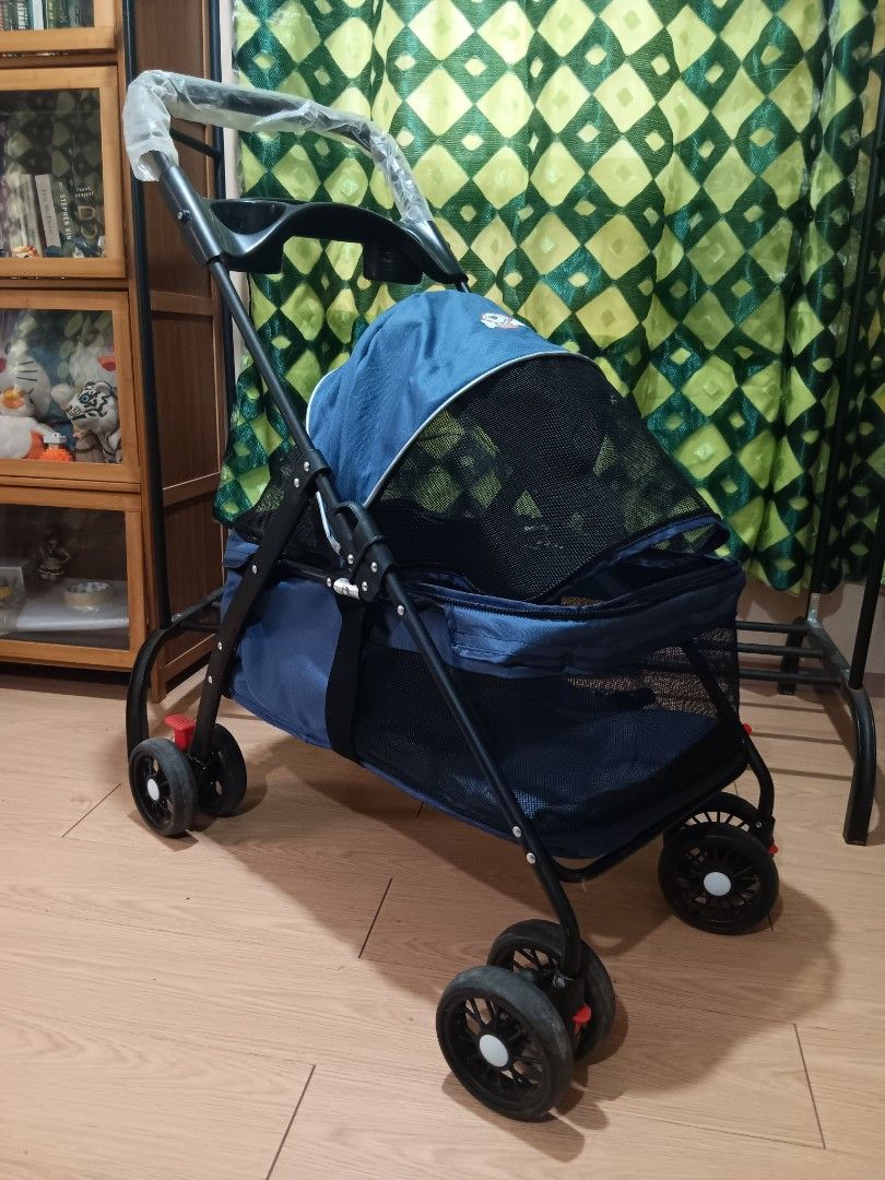 Pet Stroller (Category: Homes & Other Pet Accessories) located in Taguig. Submitted by ncomn (Listing ID 1427512805, Image 1). Description: - Blue pet stroller with mesh enclosure (zipper) - Preloved condition, please manage your expectations.