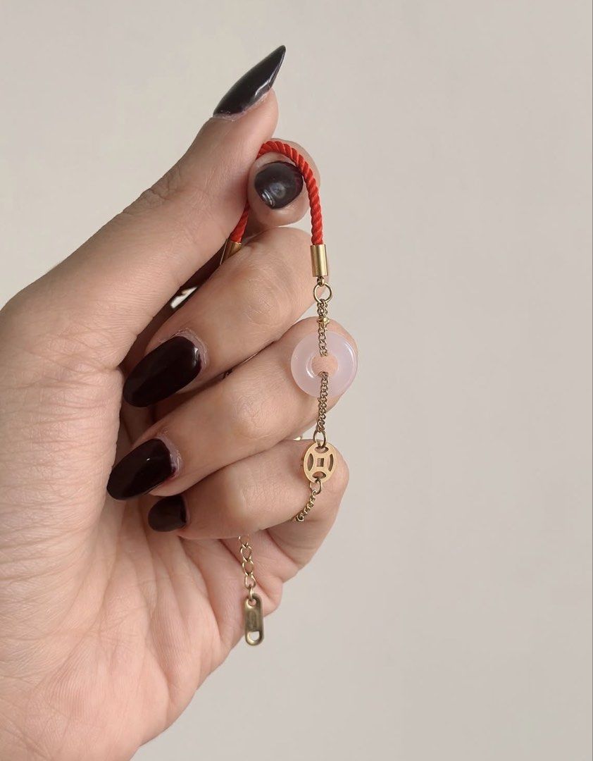 Pink Jade Red String Bracelet (Category: Bracelets) located in Paranaque City. Submitted by seektoshop (Listing ID 1427504694, Image 2). Description: Gemstone: PINK JADE Red string and Stainless Steel with Money symbol coin charm. Adjustable size comes with extenders You are the best proof of the wonders of this Pink Jade Red String bracelet. This charm is so powerful to het sudden surge of money - such as bonus, commissions, unexpected payments.