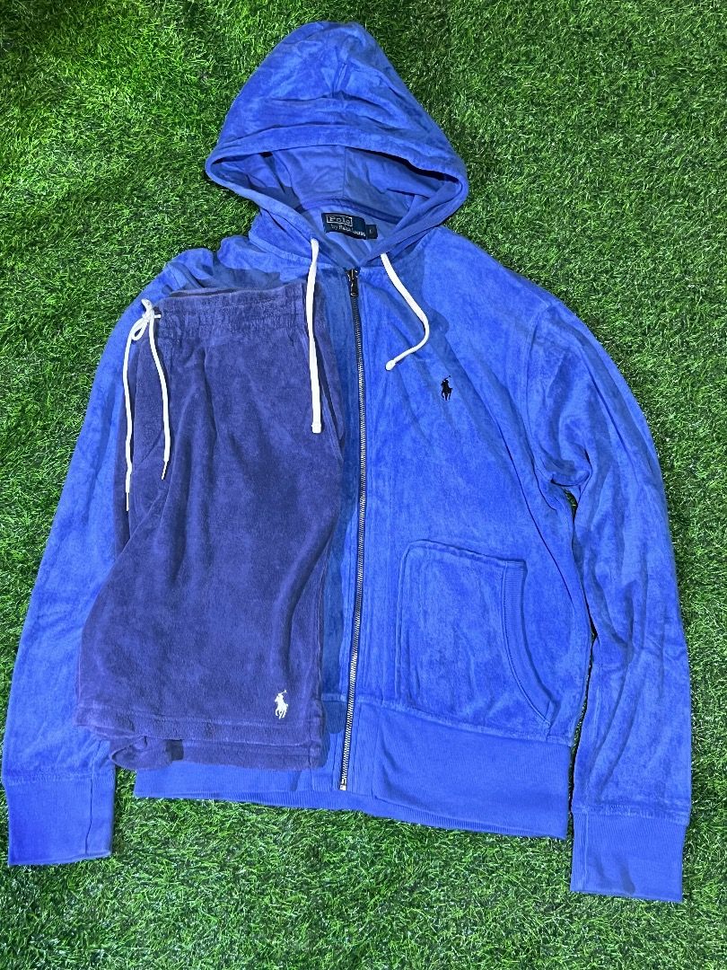 Polo by Ralph Lauren Tracksuit (Category: Sets & Coordinates) located in Manila. Submitted by dbygotpaid (Listing ID 1427593680, Image 1). Description: Polo by Ralph Lauren tracksuit includes a blue zip-up hoodie and matching shorts. The hoodie features a small embroidered logo on the chest, a hood with drawstring, and a full-length zipper. The shorts also have the Polo logo. Both pieces appear to be made of a soft, terrycloth-like material. The 