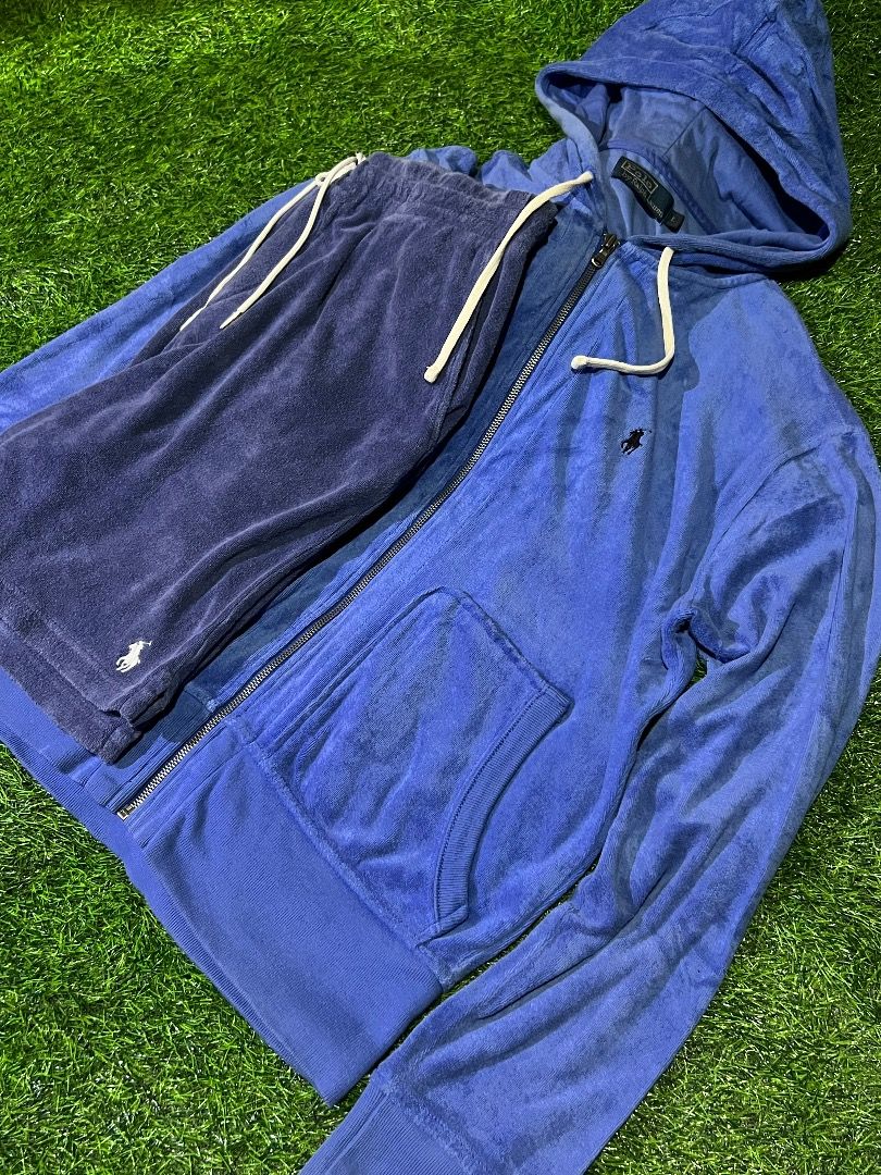 Polo by Ralph Lauren Tracksuit (Category: Sets & Coordinates) located in Manila. Submitted by dbygotpaid (Listing ID 1427593680, Image 2). Description: Polo by Ralph Lauren tracksuit includes a blue zip-up hoodie and matching shorts. The hoodie features a small embroidered logo on the chest, a hood with drawstring, and a full-length zipper. The shorts also have the Polo logo. Both pieces appear to be made of a soft, terrycloth-like material. The 