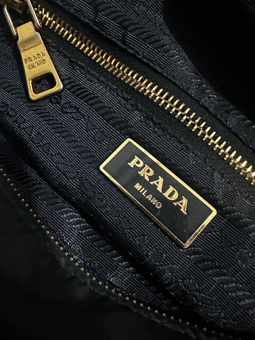Prada Hand Bag Nylon 2way Black BL0567 (Category: Luxury Bags & Wallets) located in Makati City. Submitted by rhamshoppe2027 (Listing ID 1427608699, Image 3). Description: For sale only Authentic Prada Nylon texture saffiano leather handle Purchase abroad,japan 8.5/10 verygood condtion Needs cleaning Gold hardware Clean inside ,minor issue slight zipper tarnish Used condition For serious buyer only Makati area Lalamove/gcash/bank payment .