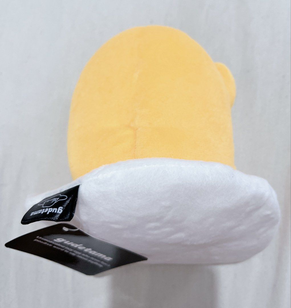 Sanrio Gudetama Plush Toy (Category: Plushies & Soft Toys) located in Mandaluyong City. Submitted by softiess143 (Listing ID 1427530539, Image 2). Description: • Bought from Sanrio shop at Singapore Airport • Brand new with Tags • Payment mode: Gcash or Landbank • Can only do Lalamove or Grab delivery • Please message me for more inquiries .