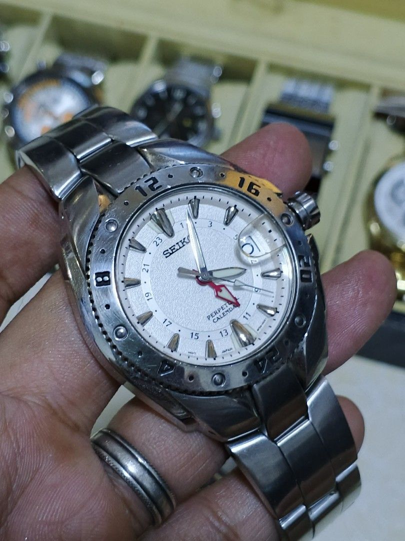 Seiko GMT Perpetual Calendar Watch (Category: Luxury Watches) located in Cavite. Submitted by el_yaz1989 (Listing ID 1427528792, Image 1). Description: Seiko Premier - Perpetual Calendar GMT( with new battery will last 3years minimum) All working Comes with extralinks Seiko watch features a silver dial with a perpetual calendar function. It has a stainless steel bracelet and a rotating bezel. The watch displays the date and has luminous hands and