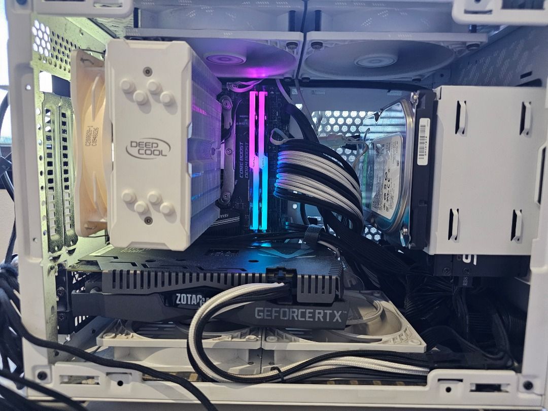 SFF WHITE - PREMIUM GAMING AND PRODUCTIVITY PC (Category: Desktops) located in Manila. Submitted by tech_by_trx (Listing ID 1427555971, Image 3). Description: Silver PC case with a perforated front panel. SFF WHITE PRODUCTIVITY AND GAMING PC Built by Tech by Trx - assembled with care, using choice parts and specs PC and Parts are Used with Care (Design and Architectural Work; No intensive Renderings or Mining); PC Refreshed as of March 8, 2026, L