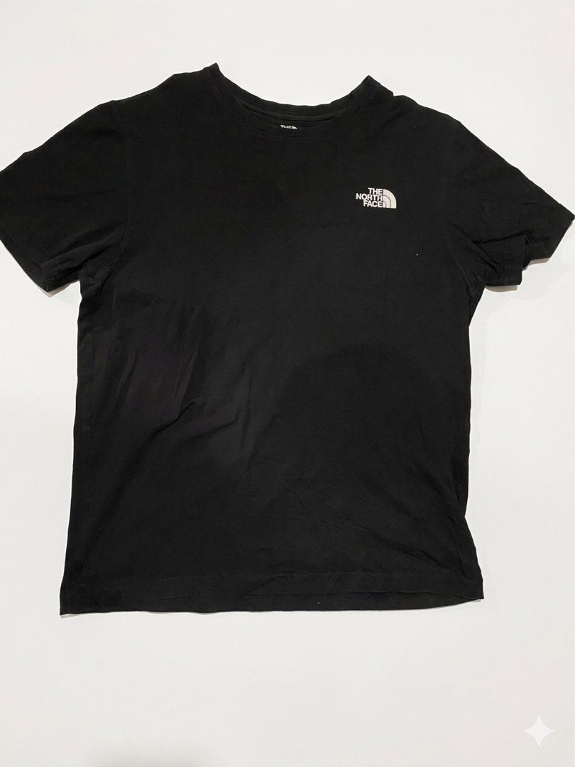 The North Face Black T-shirt (Category: Tshirts & Polo Shirts ) located in Cavite. Submitted by jamstore89 (Listing ID 1427622959, Image 1). Description: The north face shirt large 21.5x27" P400 Black The North Face t-shirt. Features the brand logo on the front. The size is L/100. The tag shows the material composition and care instructions. A classic and versatile piece for everyday wear..