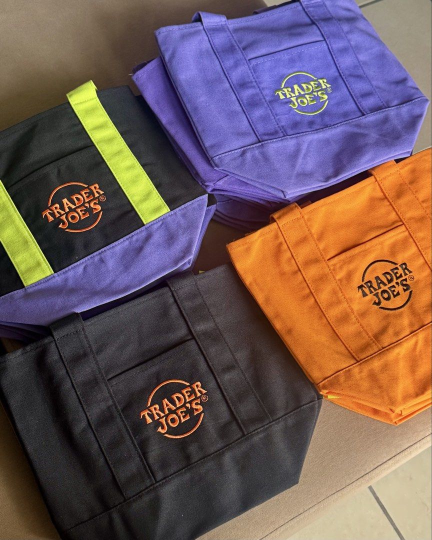 Trader Joe's Tote Bags (Category: Tote Bags) located in Quezon City. Submitted by icedcoffee_1 (Listing ID 1427504393, Image 2). Description: TRADER JOE’S TOTE BAG — from the US 🇺🇸 🛍 Mini Canvas Tote – ₱600 | Colors: Green, Blue, Yellow, Red 🛍 Large Tote – ₱850 | Color: Green 🎃 Halloween Limited Edition Mini Tote – ₱750 | Colors: Black, Orange, Mixed, Purple ✨ Limited stocks available 📩 Send me a message to order ☺️ 📍 QC.