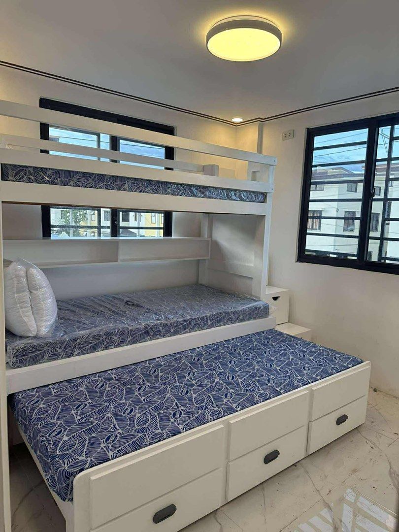 Wood Bunk Bed with Pull Out Bed and Storage (Category: Bed Frames & Mattresses) located in Pasig City. Submitted by airizev (Listing ID 1427488443, Image 2). Description: Wood bunk bed with pull out bed and storage drawers. Inclusions: - 4” 36x75 Uratex Foam Bed (2 pcs) - 4” 30x75 Uratex Foam Bed (1 pc) - 7 storage drawers.