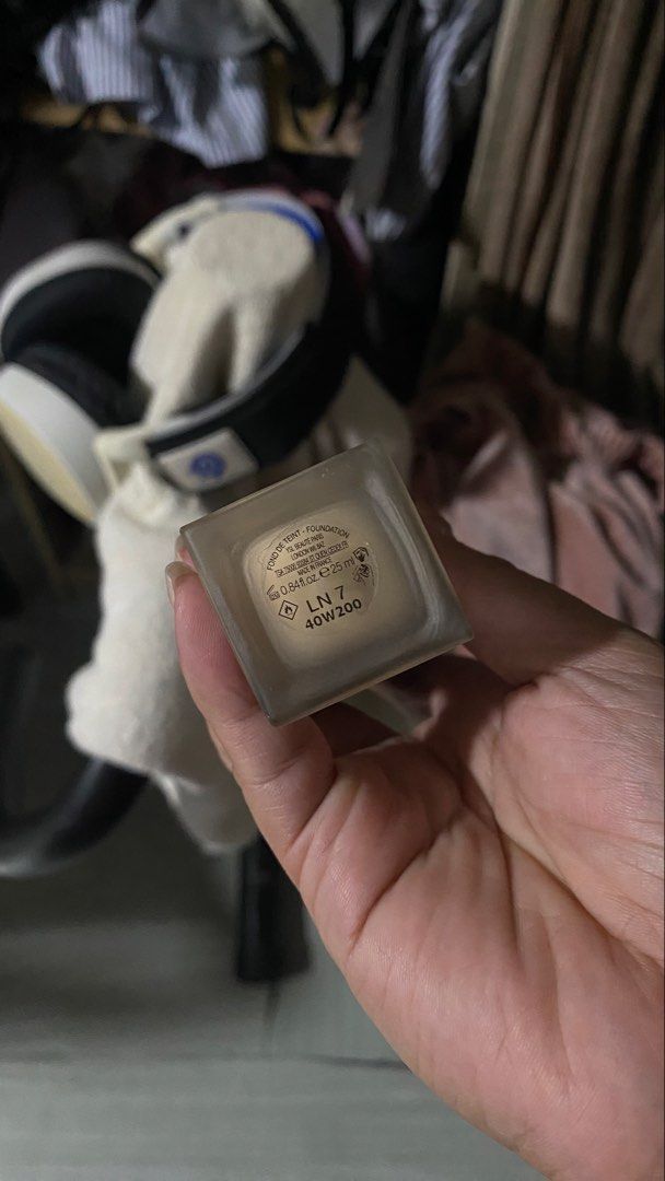 YSL All Hours Foundation (Category: Makeup) located in Manila. Submitted by declutterwithpeanut (Listing ID 1426435063, Image 2). Description: Around 70-80% YSL All Hours Foundation. This foundation is in a clear bottle with a black cap featuring the YSL logo. It is a matte foundation. The bottle contains a light beige foundation. The product is in a rectangular bottle..
