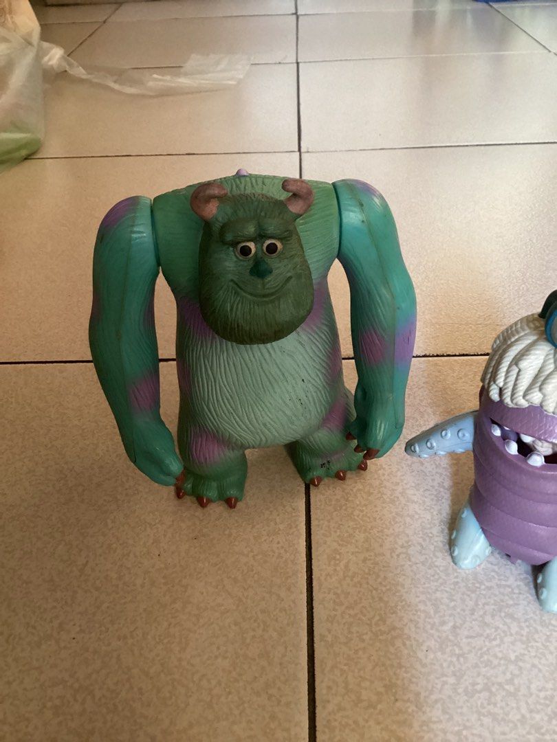 2001 Monsters, Inc. McDonald's Toy Figures (Category: Figurines & Statues) located in Caloocan City. Submitted by lostrtrp (Listing ID 1427732103, Image 2). Description: Set of four Monsters, Inc. toy figures from McDonald's. Includes Sulley, Boo, Mike Wazowski, and Randall. The figures are made of plastic and appear to be from a promotional set. The underside of Mike Wazowski and the bug-like character show the McDonald's and Disney Pixar markin