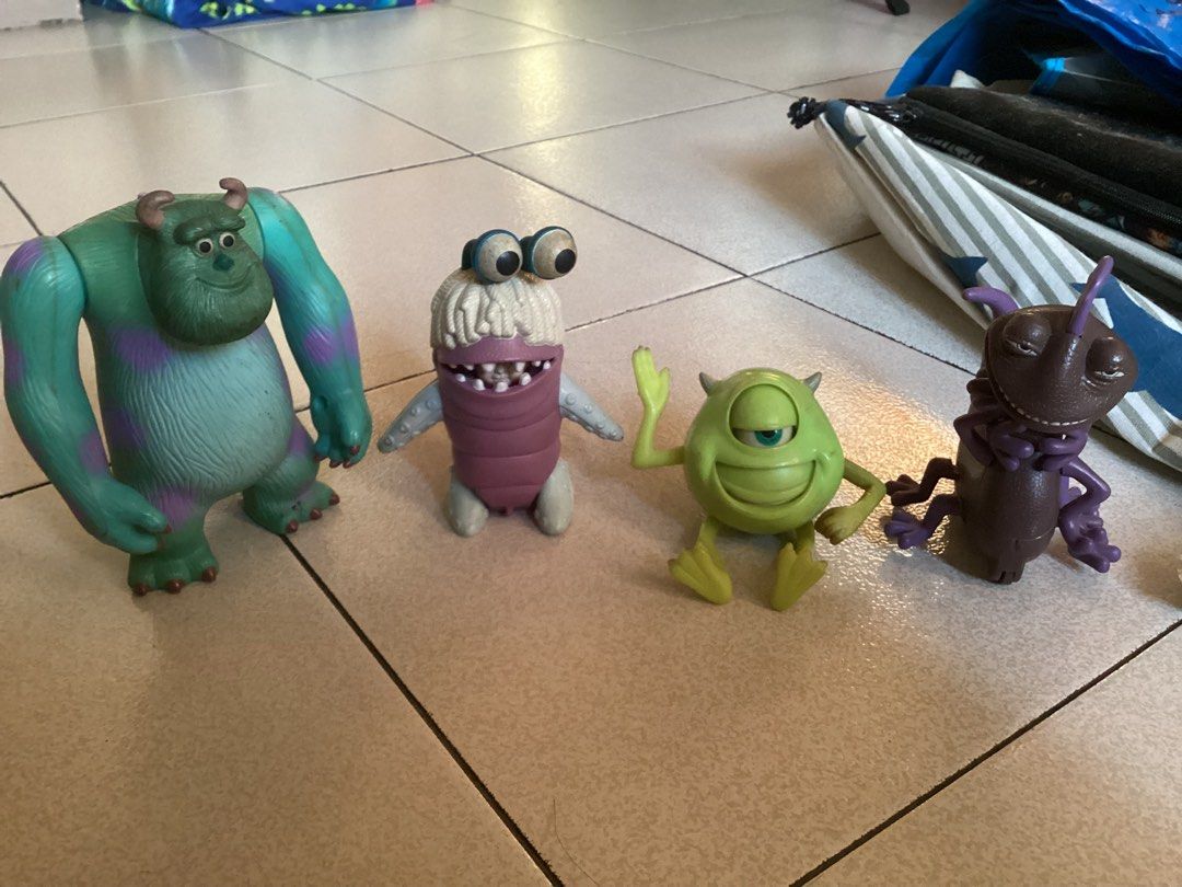 2001 Monsters, Inc. McDonald's Toy Figures (Category: Figurines & Statues) located in Caloocan City. Submitted by lostrtrp (Listing ID 1427732103, Image 1). Description: Set of four Monsters, Inc. toy figures from McDonald's. Includes Sulley, Boo, Mike Wazowski, and Randall. The figures are made of plastic and appear to be from a promotional set. The underside of Mike Wazowski and the bug-like character show the McDonald's and Disney Pixar markin