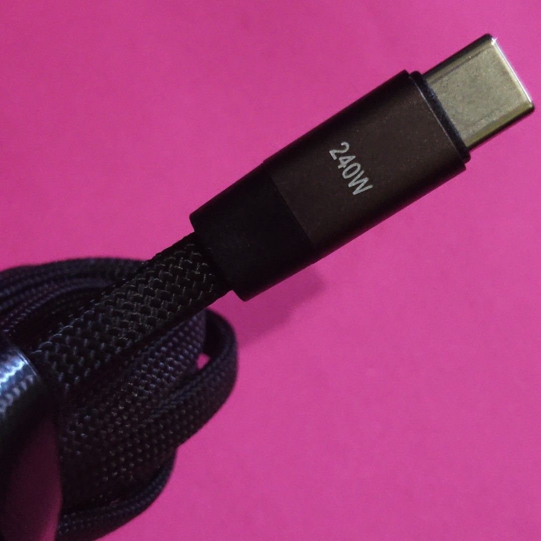 240W USB-C Charging Cable (Category: Chargers & Cables) located in Paranaque City. Submitted by audioaddict0517 (Listing ID 1427693366, Image 1). Description: USB-C charging cable supports up to 240W charging. It features a durable braided design and includes a cable organizer. The cable has a USB-C connector on both ends, with one end angled. It is designed for fast and efficient charging..