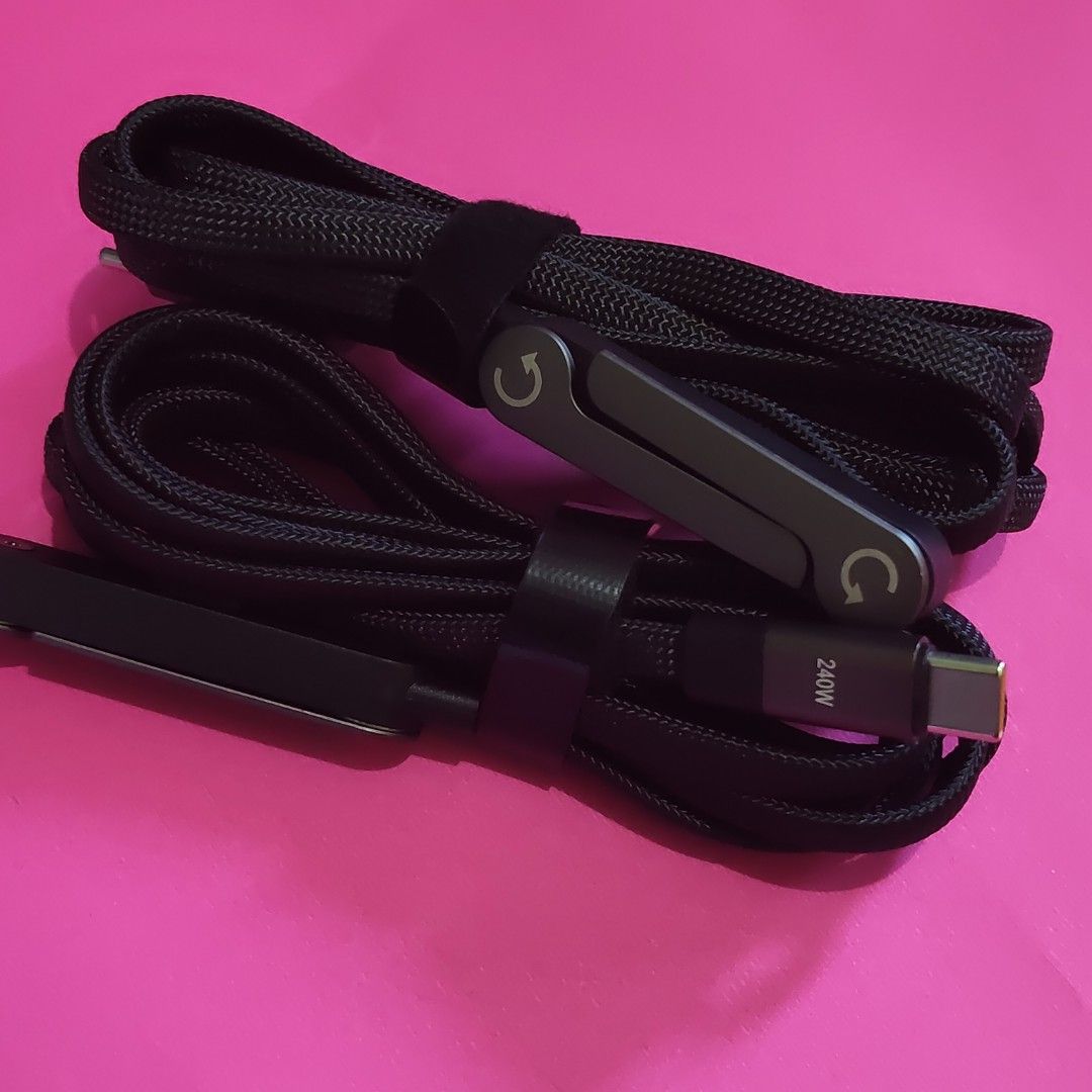 240W USB-C Charging Cable (Category: Chargers & Cables) located in Paranaque City. Submitted by audioaddict0517 (Listing ID 1427693366, Image 2). Description: USB-C charging cable supports up to 240W charging. It features a durable braided design and includes a cable organizer. The cable has a USB-C connector on both ends, with one end angled. It is designed for fast and efficient charging..