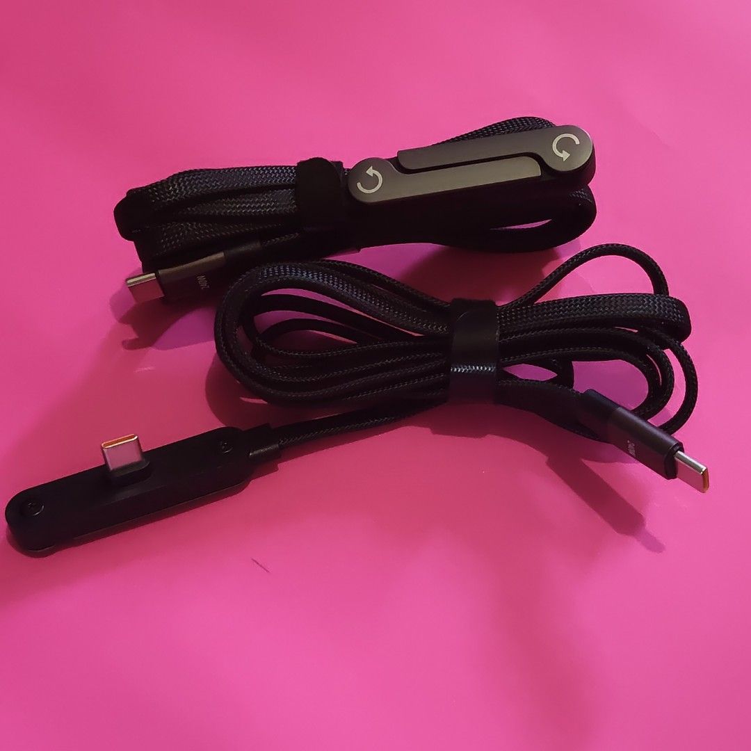 240W USB-C Charging Cable (Category: Chargers & Cables) located in Paranaque City. Submitted by audioaddict0517 (Listing ID 1427693366, Image 3). Description: USB-C charging cable supports up to 240W charging. It features a durable braided design and includes a cable organizer. The cable has a USB-C connector on both ends, with one end angled. It is designed for fast and efficient charging..