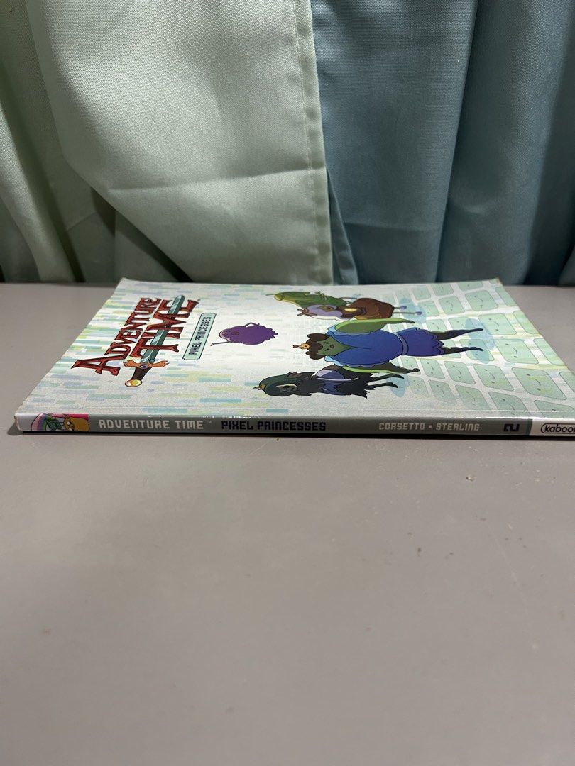 Adventure Time: Pixel Princesses (Kaboom / Cartoon Network) (Category: Comics & Manga) located in Dumaguete. Submitted by bunchings.books (Listing ID 1427661309, Image 3). Description: 📚 Adventure Time: Pixel Princesses (Kaboom / Cartoon Network) 💰 Price: ₱350 ⸻ ✨ Details: • Official Adventure Time graphic novel • Title: Pixel Princesses • Written by Danielle Corsetto • Fun, light read with full illustrations • Paperback ⸻ 📌 Condition: • Good 
