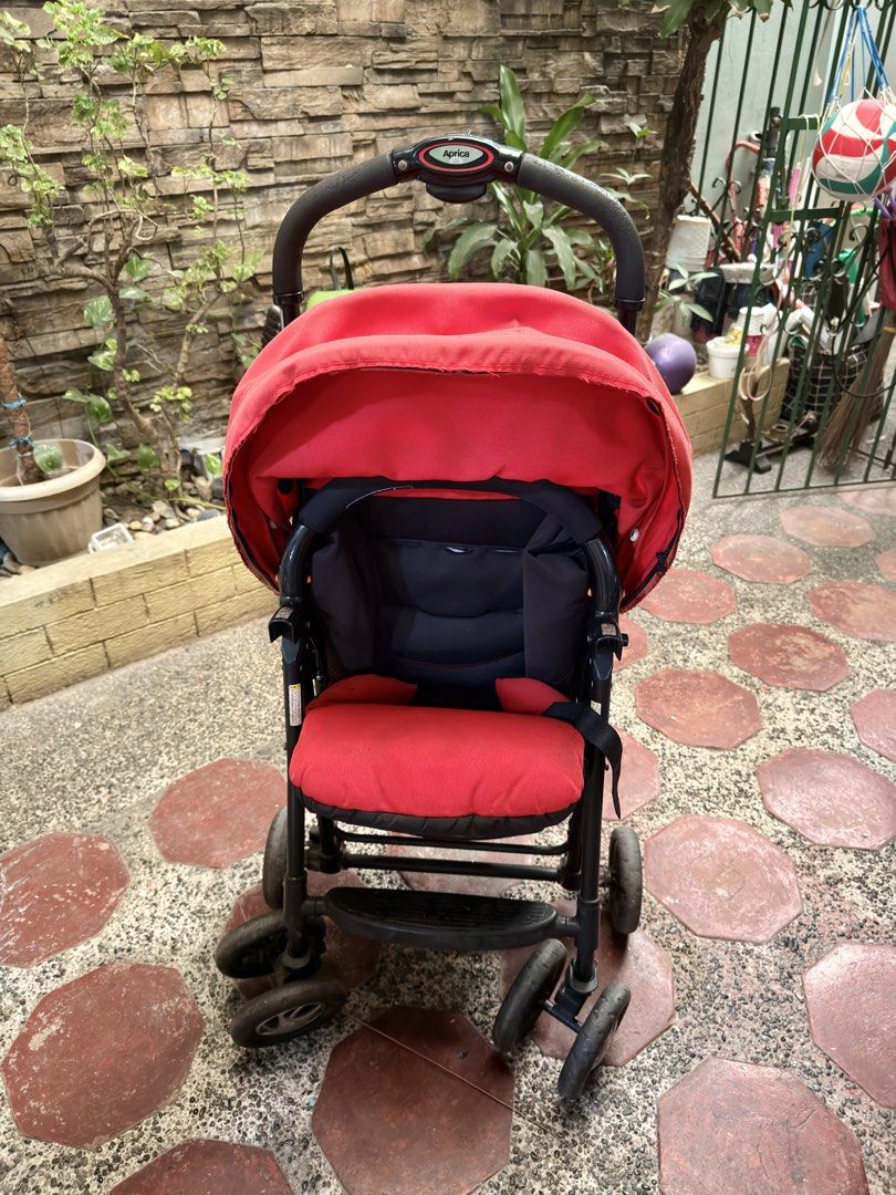 Aprica Red Stroller (Category: Strollers) located in Pasig City. Submitted by mamasboyforlife (Listing ID 1427643615, Image 1). Description: Wheels work perfectly. Cushion needs washing..